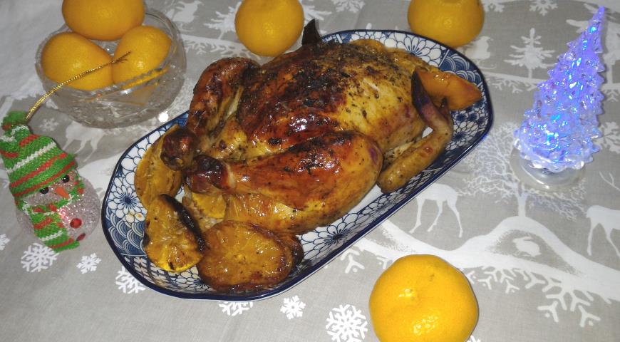 Фото приготовления рецепта: Курица с мандаринами, запеченная в духовке, шаг №9